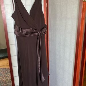 Brown dress with underlining and a side zipper. Dress wore only once.